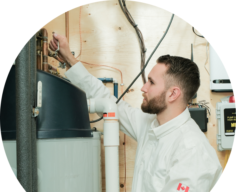 Oosterveld water heater specialist adjusts piping on a large residential unit during a repair service, with exposed wood paneling and mounted utility components in the background. Oosterveld water heater specialist adjusts piping on a large residential unit during a repair service, with exposed wood paneling and mounted utility components in the background.