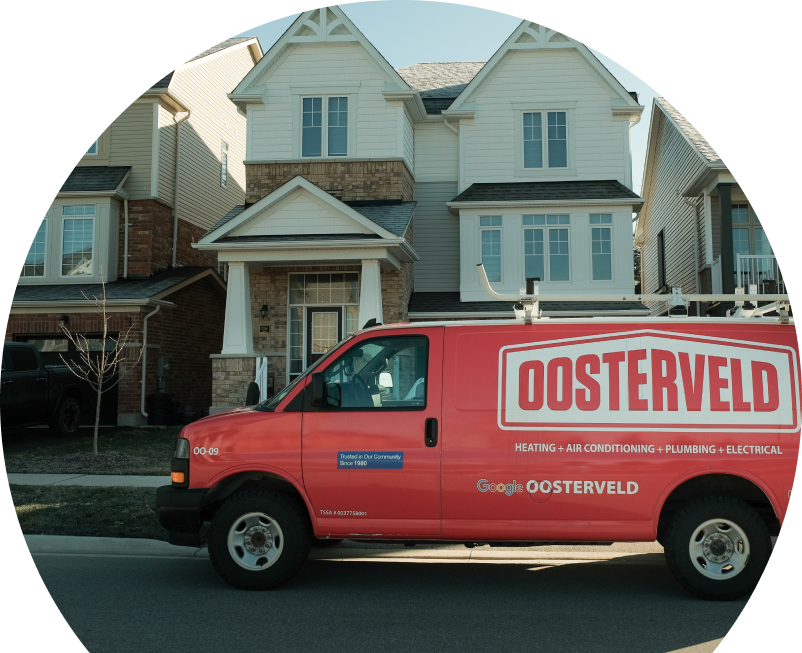 Oosterveld service van parked by a brick home highlighting trusted plumbing, heating & electrical expertise since 1980. Oosterveld service van parked by a brick home highlighting trusted plumbing, heating & electrical expertise since 1980.