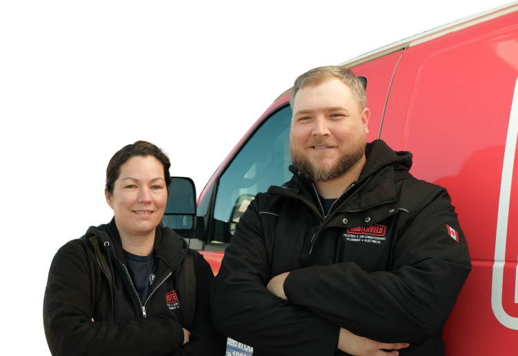 Two Oosterveld technicians smiling in front of their green service van, wearing issued jackets during an on-site consultation.