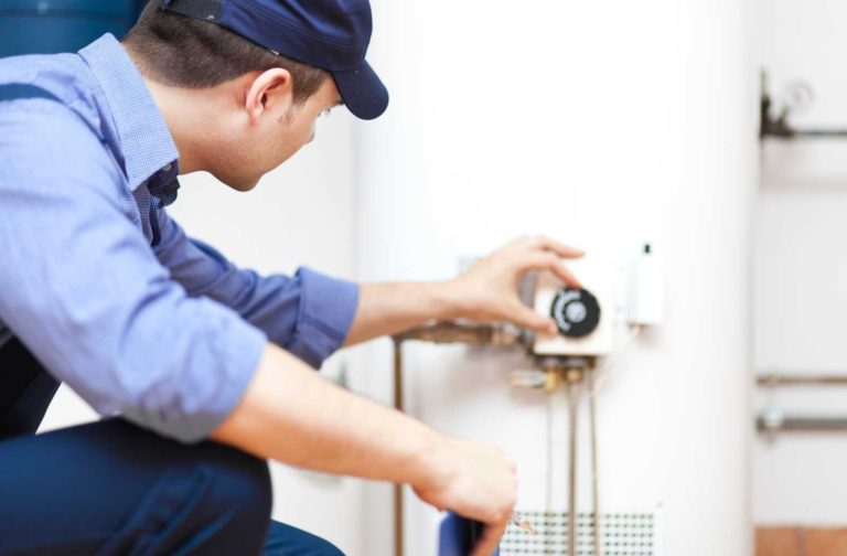 man-in-overalls-checking-water-heater-768×504-1 man-in-overalls-checking-water-heater-768×504-1
